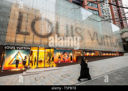 TOKYO, Japan - A sales clerk shows a Louis Vuitton merchandise at the  company's new store in Roppongi Hills. The photo was taken Sept. 4, 2003.  (Kyodo Stock Photo - Alamy