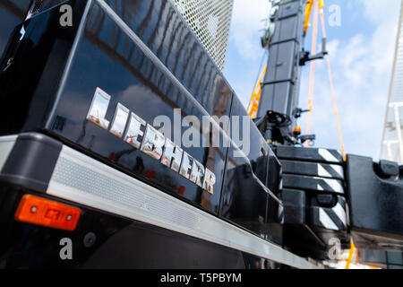 MUNICH / GERMANY - APRIL 14, 2019: Liebherr logo on a black crane at a Liebherr machine dealer. Stock Photo