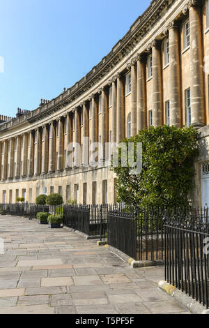 BATH, England - APRIL19, 2019:  The Circus is a historic street of large townhouses in the city of Bath, Somerset, England, forming a circle with thre Stock Photo