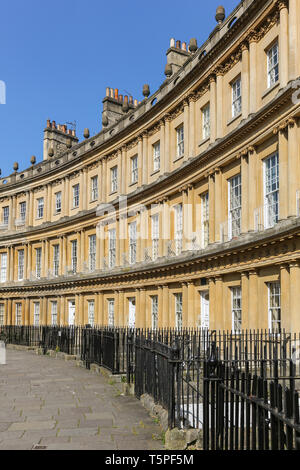 BATH, England - APRIL19, 2019:  The Circus is a historic street of large townhouses in the city of Bath, Somerset, England, forming a circle with thre Stock Photo