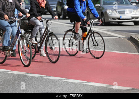 Cyclists on red Bicycle Lane Stock Photo