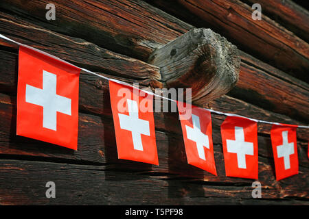 swiss flag pennant on Woodhouse Stock Photo