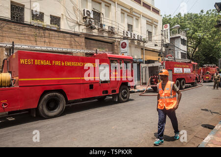 Kolkata, India. 26th Apr, 2019. A man walks past the fire site of a four-storied commercial building in Kolkata, India, April 26, 2019. No injuries have been reported so far. Credit: Tumpa Mondal/Xinhua/Alamy Live News Stock Photo