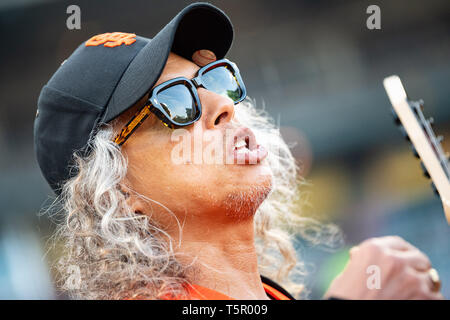 San Francisco, California, USA. 26th Apr, 2019. James Hetfield of Metallica  warms up for the ''Star Spangled Banner'', before a MLB game between the  New York Yankees and the San Francisco Giants