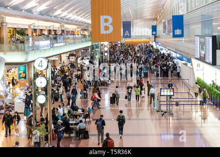 Tokyo, Japan. 27th Apr, 2019. Passengers wait for their flights at the departure lobby of Haneda Airport Terminal 2 in Tokyo. This year is expected to reach a record high of travelers to overseas and domestically destinations during an unusual 10-day Golden Week holiday due to the ascension to the throne of Crown Prince Naruhito and the start of the new Reiwa Era. The Golden Week holiday runs from April 27 to May 6. Credit: Rodrigo Reyes Marin/AFLO/Alamy Live News Stock Photo