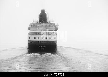 Black And White Photo Of The Hurtigruten Ship, MS NORDLYS, Sailing Through Thick Sea Fog In Norway. Stock Photo