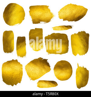 Collection of gold paint stokes on paper shiny and reflective isolated on white background Stock Photo