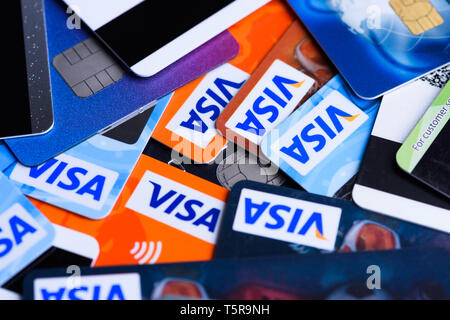 Krakow, Poland - June 16, 2017: Pile of plastic bank Visa payment cards, credit and debit. Stock Photo