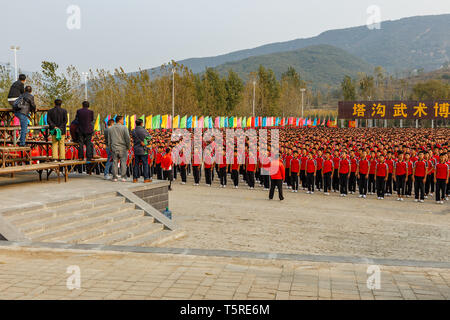 Dengfeng, China - October 17, 2018: School of martial arts Kung Fu. Students standing in the square in front of the teacher. Shaolin. Stock Photo