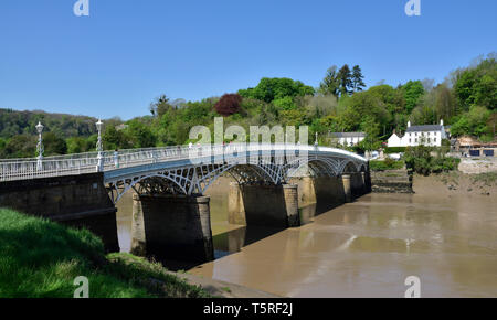Chepstow bridge which crosses River Wye between Monmouthshire Wales and Gloucester England so can stand with a foot in each country Stock Photo