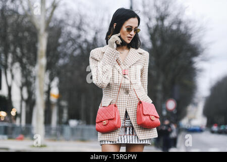 Paris, France - March 5, 2019: Street style - Woman wearing Blazer jacket,  double red Chanel bags before a fashion show during Paris Fashion Week - PF  Stock Photo - Alamy
