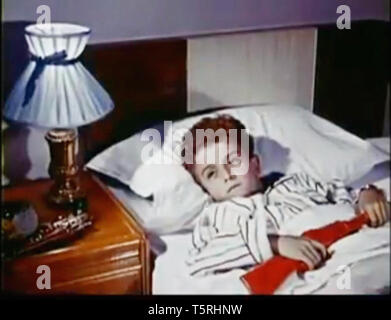 Vintage screenshot of a boy in bed Stock Photo