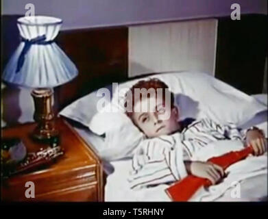 Vintage screenshot of a boy in bed Stock Photo