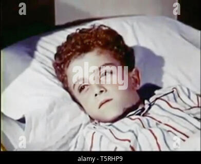 Vintage screenshot of a boy in bed Stock Photo