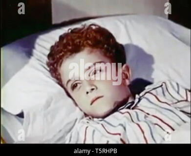 Vintage screenshot of a boy in bed Stock Photo