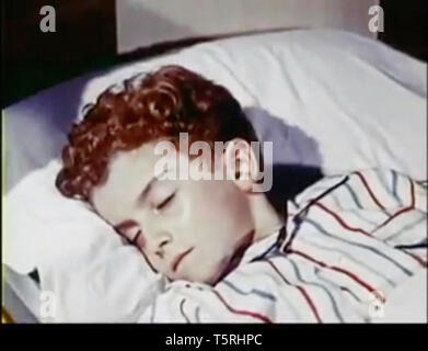 Vintage screenshot of a boy in bed Stock Photo