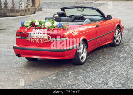 Wedding convertible Red car with text JUST MARRIED on outdoor Stock Photo