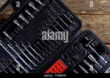 Box with special tools full of various tools on wooden background. Top view Stock Photo