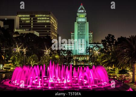 Pink neon water fountain in front of Los Angeles City Hall at night Stock Photo