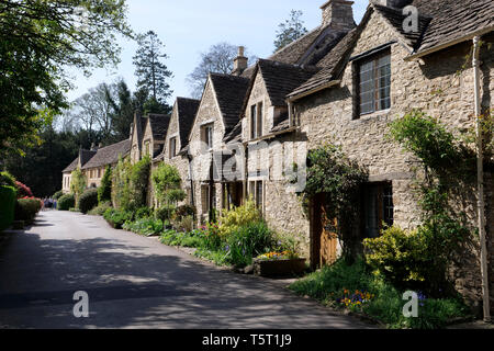 View of a row of Cotswold Stone cottages in Castle Coombe The Cotswolds Wiltshire England Stock Photo