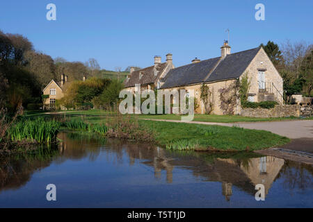 View of the River Eye in Upper Slaughter in the Cotswolds England Stock Photo