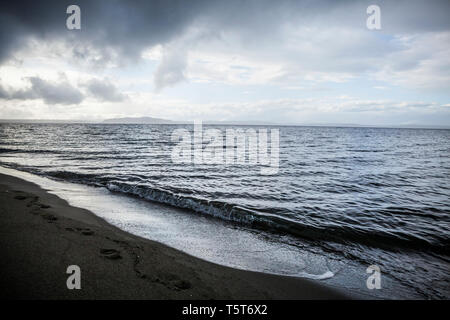 A storm clears away over the Puget Sound and Alki Beach, West Seattle, Washington, USA. Stock Photo