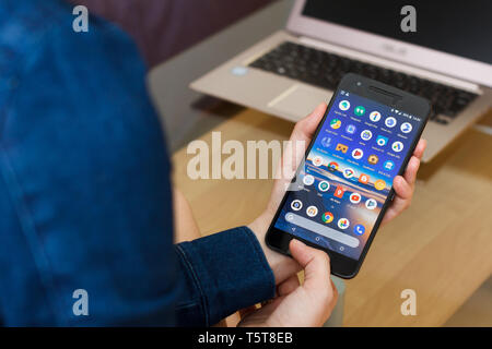 SAN FRANCISCO, US - 22 April 2019: Close up to female hands holding smartphone using Google Services and Applications, San Francisco, California, USA. Stock Photo