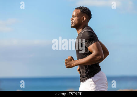 Black african american young man running outdoor Stock Photo