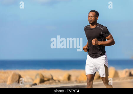Black african american young man running outdoor Stock Photo