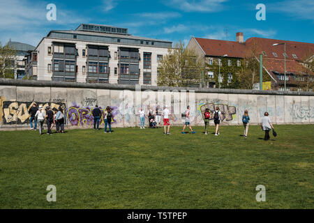 Berlin, Germany - April, 2019: Tourist people taking pictures at the  Berlin Wall Memorial  Berlin, Mitte Stock Photo