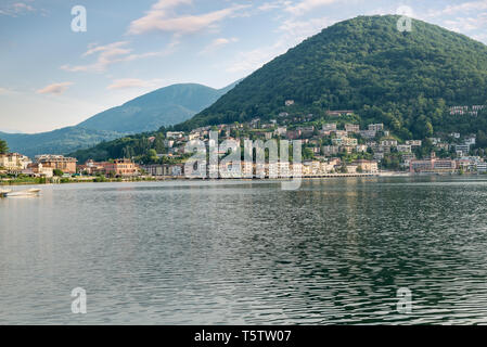 Lake Lugano with the customs bridge between Lavena Ponte Tresa on the left in Italy and Ponte Tresa on the right in Switzerland Stock Photo