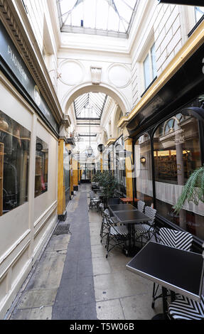 PARIS, FRANCE - April 22 , 2019: Passage des Panoramas is the oldest covered passages of Paris. Passage was opened in 1800 on site of town residence o Stock Photo