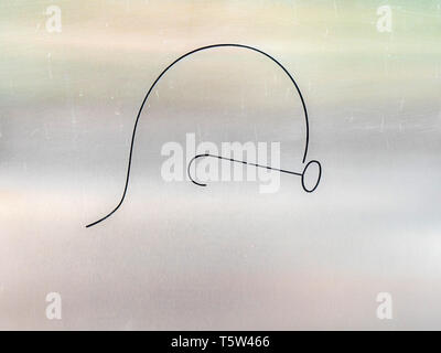 Minimal two line drawing instantly recognisable as Mahatma Ghandi on a stainless steel plaque at Ghandi's memorial Raj Ghat in Delhi northern India Stock Photo
