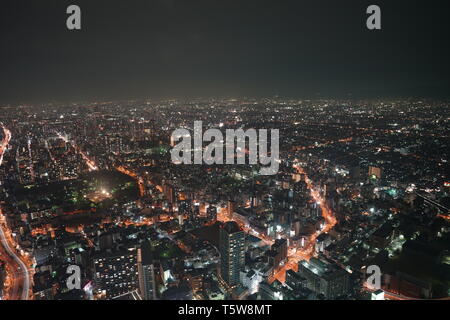 Network connection with neon light circle and Empty inside for any corporate logos or icon., in high building background at night. Stock Photo