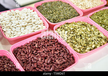 Pumpkin seeds and beans in the store Stock Photo
