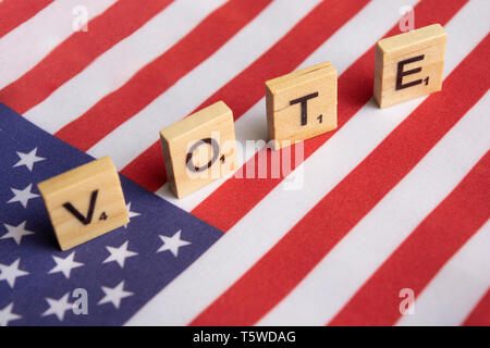 Maski, India 26, April 2019 : Vote wooden block letters on US flag Stock Photo