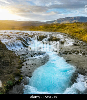 The beautiful Icelandic waterfall Bruarfoss is fed by glacier waters which give it the Turquoise color. Stock Photo