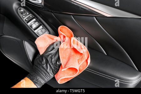 Hand with microfiber cloth cleaning seat, auto detailing and valeting  concept, washing car care interior, selective focus Stock Photo - Alamy