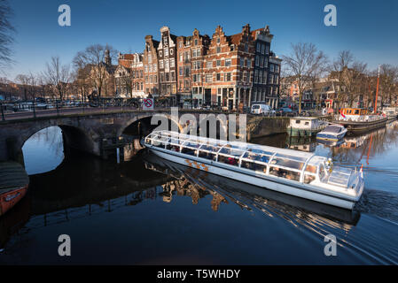 Amsterdam, Netherlands - February 2016: Canal cruiser on the Prinsengracht canal Stock Photo