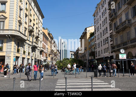 Milan, Italy -  March 31, 2019: People walk along Corso Como, a pedestrian street, ideal of a drink and shopping, fashion spot in Porta Nuova district Stock Photo
