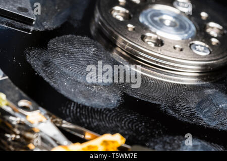 Hard disk drive spoiled by being touched & covered with fingerprints. Hard disk in need of data recovery. Lost, ruined or corrupted computer data. Stock Photo