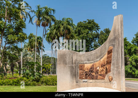 Darwin Australia - February 22, 2019: Concrete and brown stone memorial commemorating the centenary of laying of overseas cable to Java under blue sky Stock Photo