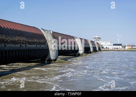 Eidersperrwerk (Eider Barrage) at the mouth of the river Eider on Germany’s North Sea coast. It is Germany’s largest coastal protection structure. Stock Photo