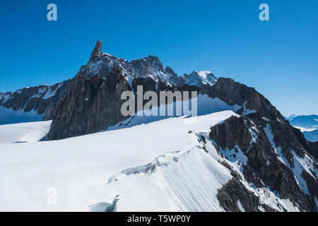 The Dente Del Gigante shooted from the clabeway station of Punta Helbronner in a sunny day with blue sky Stock Photo