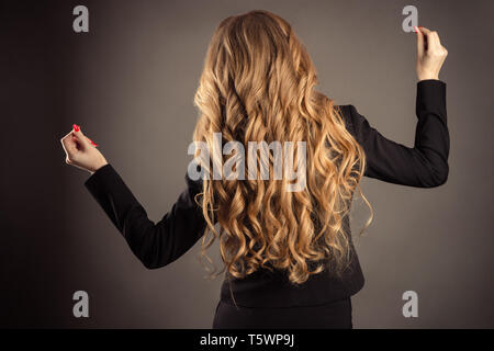 successful business woman with gorgeous wavy hair Stock Photo