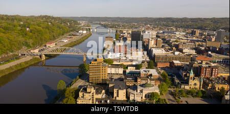 Sunrise reflects in the Kanawha River slowly flowing by picturesque Charleston West Virginia downtown Stock Photo