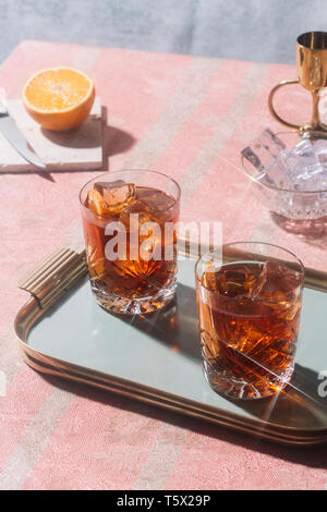 Negroni, an Iba cocktail, with 1/3 gin, 1/3 bitter, 1/3 vermut, in luxury pop style, rich and colorful. Stock Photo