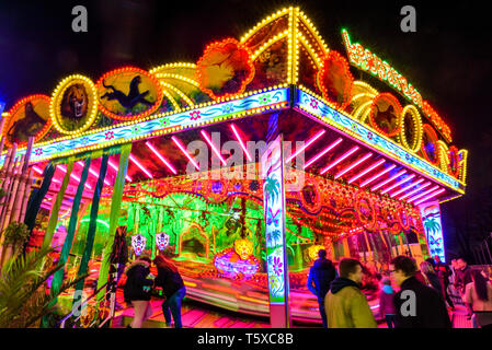 Colorful illuminated fairground attraction Stock Photo