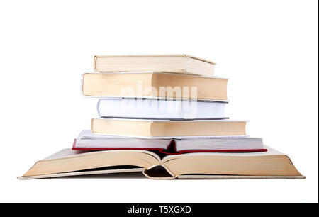 Stack of open and closed hardback cover books isolated on white background. Stock Photo