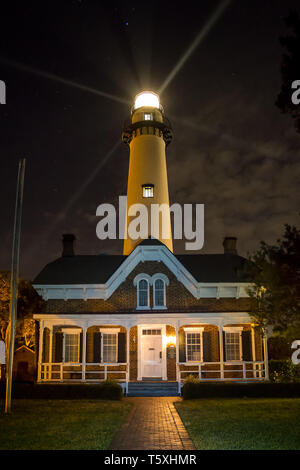 Beams of light project from St. Simons Lighthouse on St. Simons Island in Georgia. Stock Photo